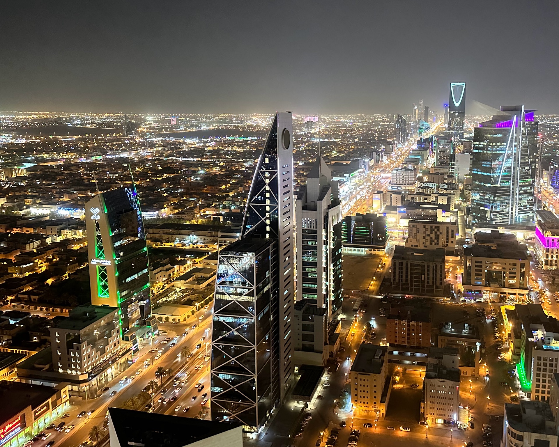 view of dubai at night from atop the burjt